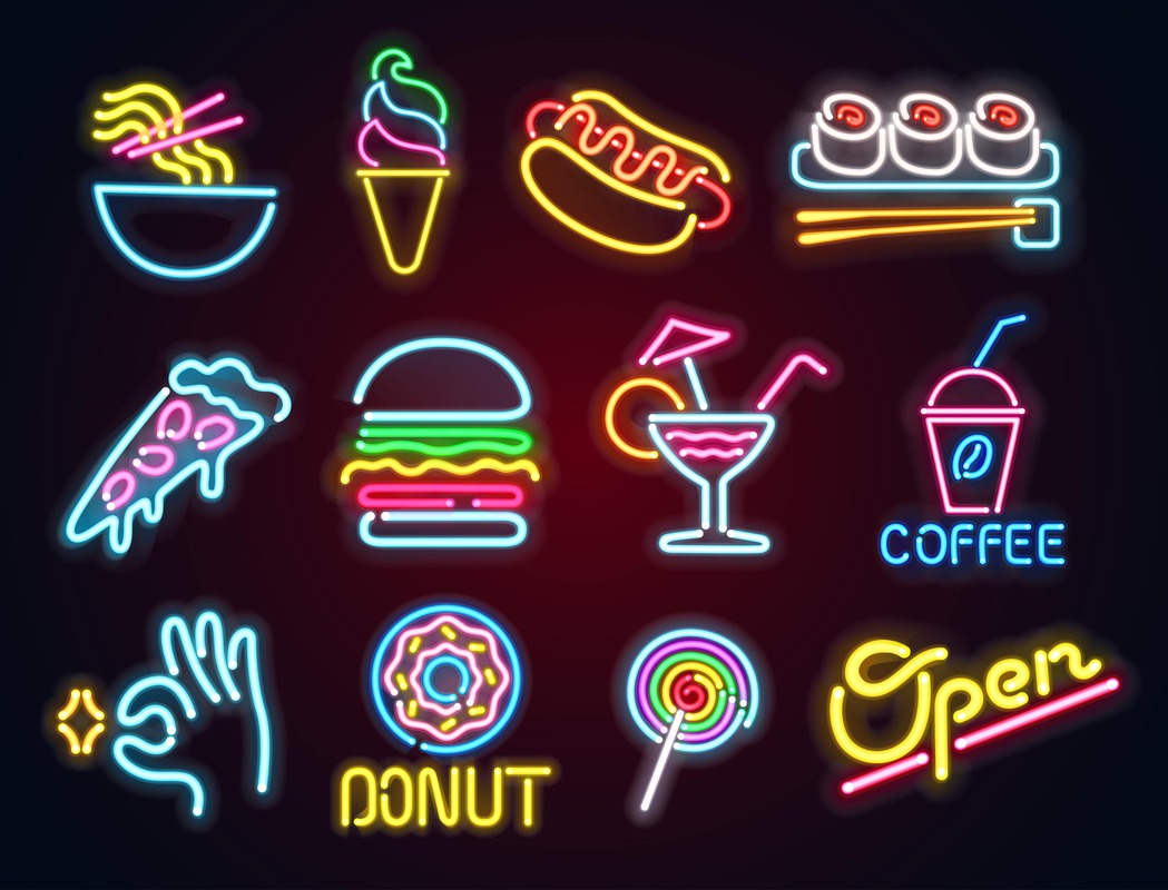 Various food neon signs displayed on a building