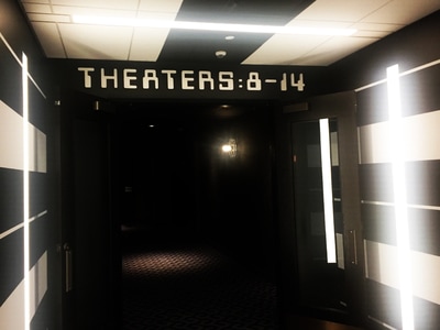 Theaters 8-14 Sign displayed in movie theater