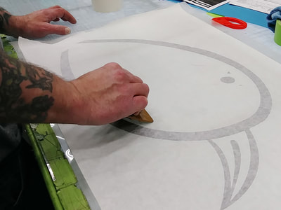 Employee drafting the image for a sign