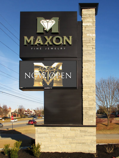 Maxon Fine Jewelry Gold Sign With White and Gold Diamond