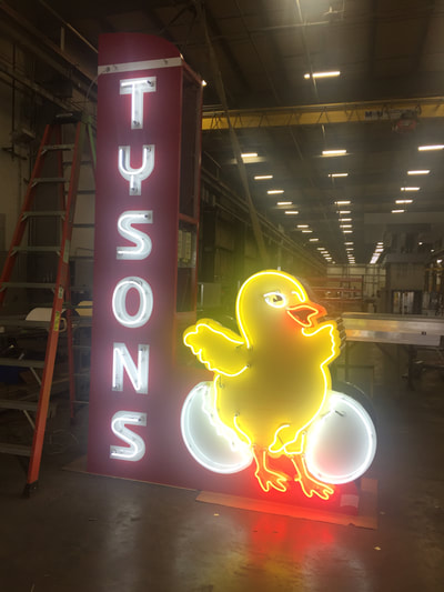 Tyson's neon sign lighting up