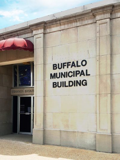 Black Buffalo Municipal Building Lettering on White Stone Wall
