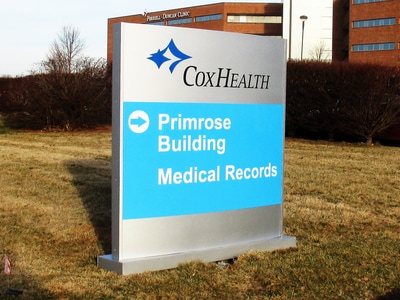 Cox Health Primose Building Medical Records blue and gray sign