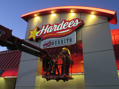 Hardees Sign Being Installed
