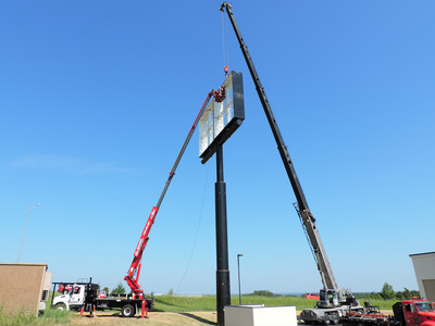 Billboard sign being installed at business