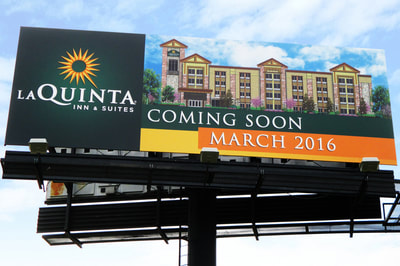 La Quinta Inn & Suites dark green sign